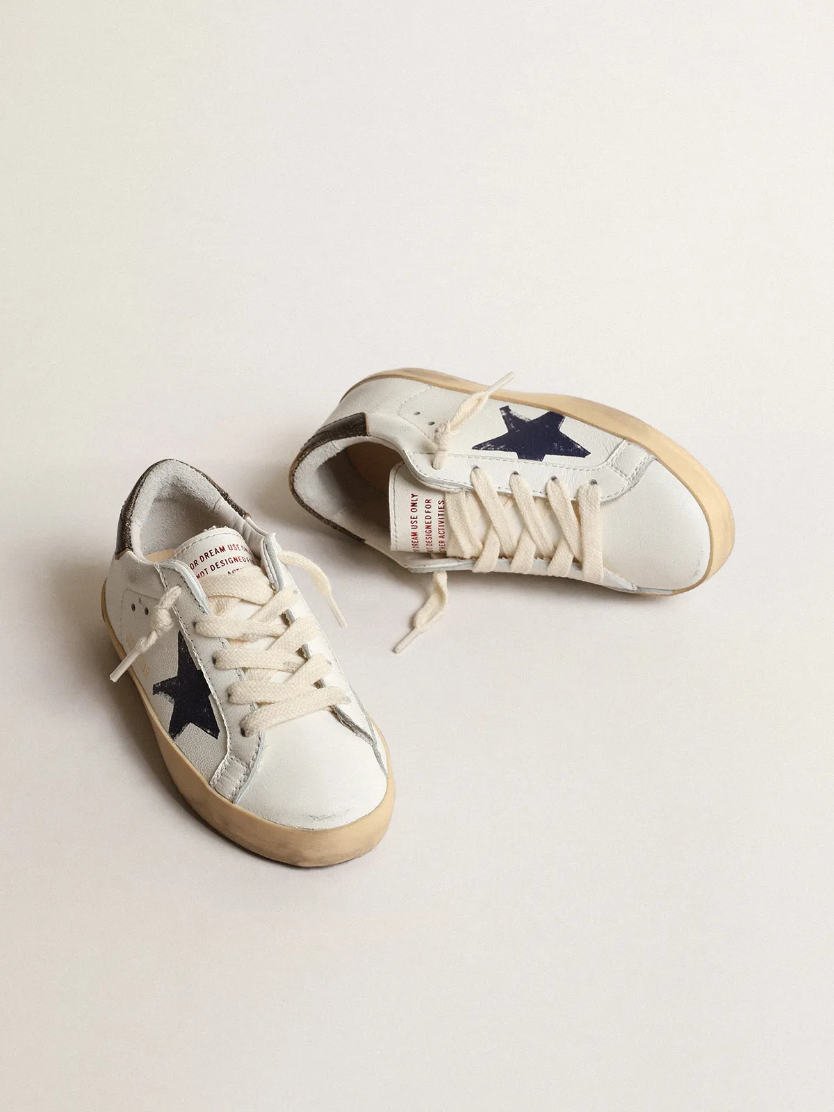 Super-Star Junior in nappa with a printed star and black heel tab